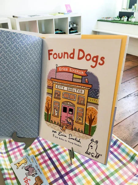 Photo of the inside cover of the book "Found Dogs" by Erica Sirotich, signed by her with a dog drawing.