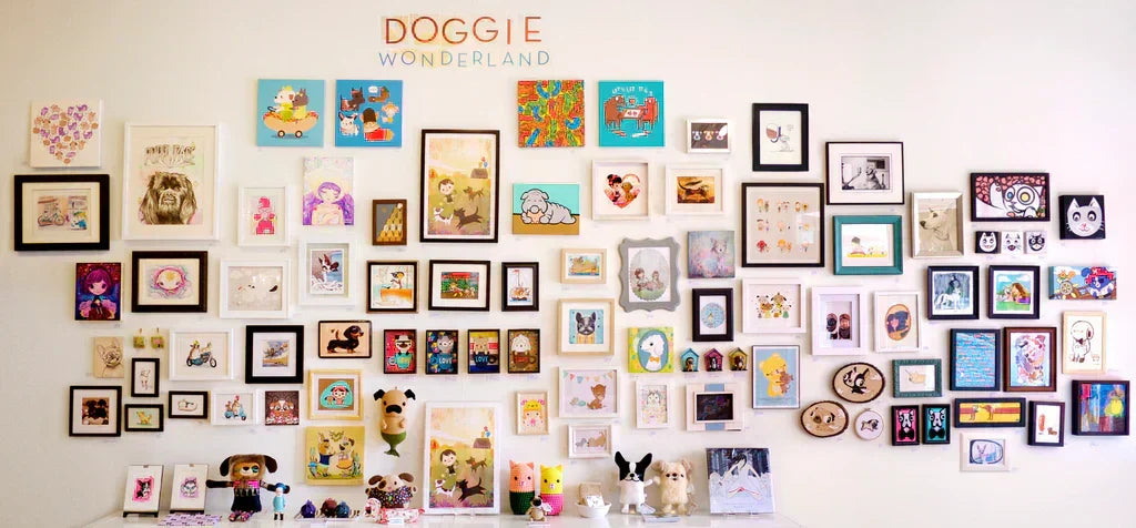 Photo of "Doggie Wonderland" art show gallery wall. Featuring seventy plus different art pieces of dogs in different art syles.
