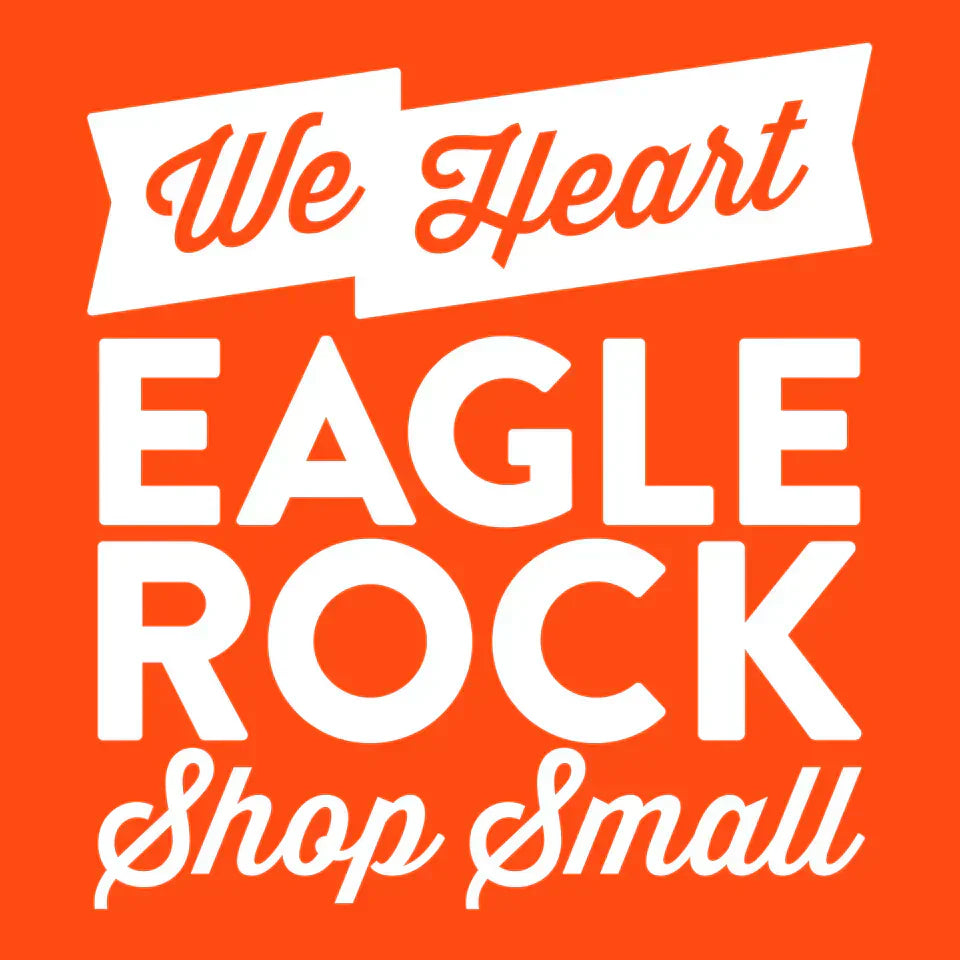 White text on orange background that says "We Heart Eagle Rock Shop Small".