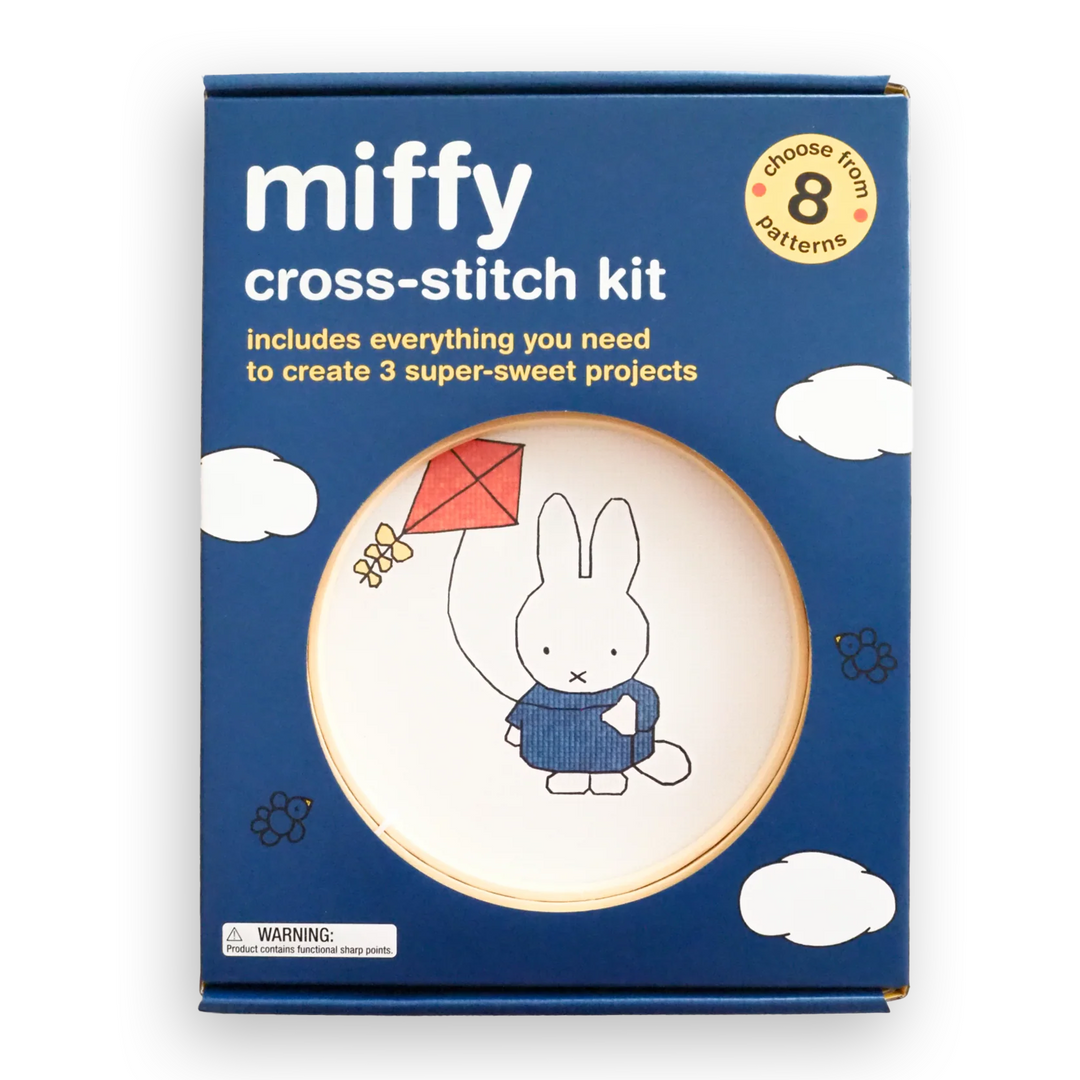 Miffy Cross-Stitch Kit in blue packaging box, featuring a circular wooden hoop with a white fabric insert printed with Miffy holding a red kite.