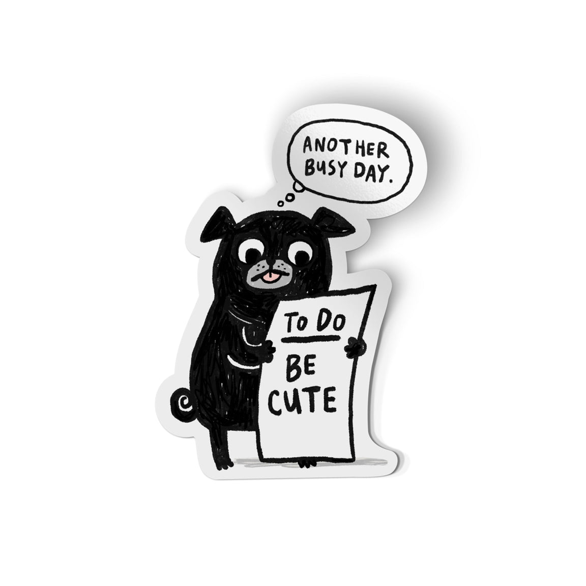A die-cut sticker featuring a black cartoon pug holding a sign that reads 'To Do: Be Cute' with a speech bubble above that says 'Another Busy Day.' on a plain white background.
