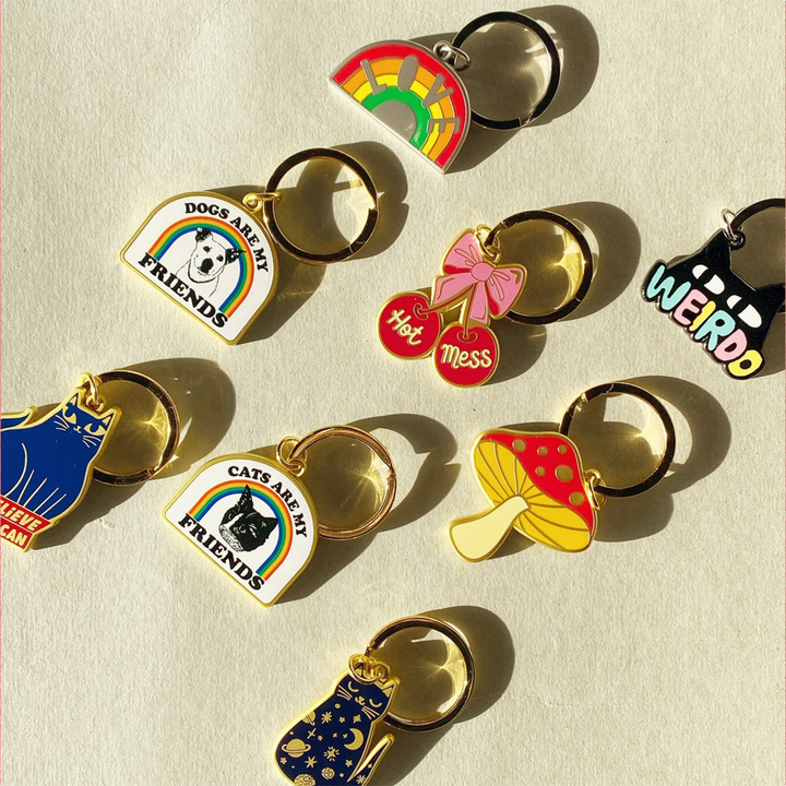 Collection of colorful keychains including the &
