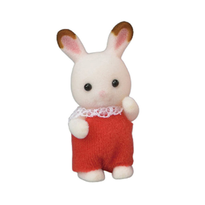 A flocked white rabbit figure with brown-tipped ears in a red outfit with white lace frill collar. With one arm up.