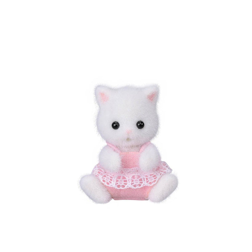 A small flocked white cat figurine wearing a pink dress with a white lace hem, centered on a plain white background.