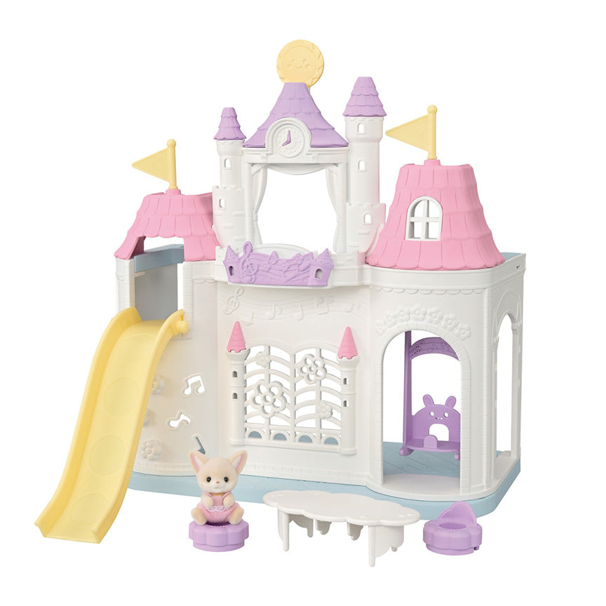 Children's pink, purple, and white toy castle with slide and baby fox figurine on a white background.