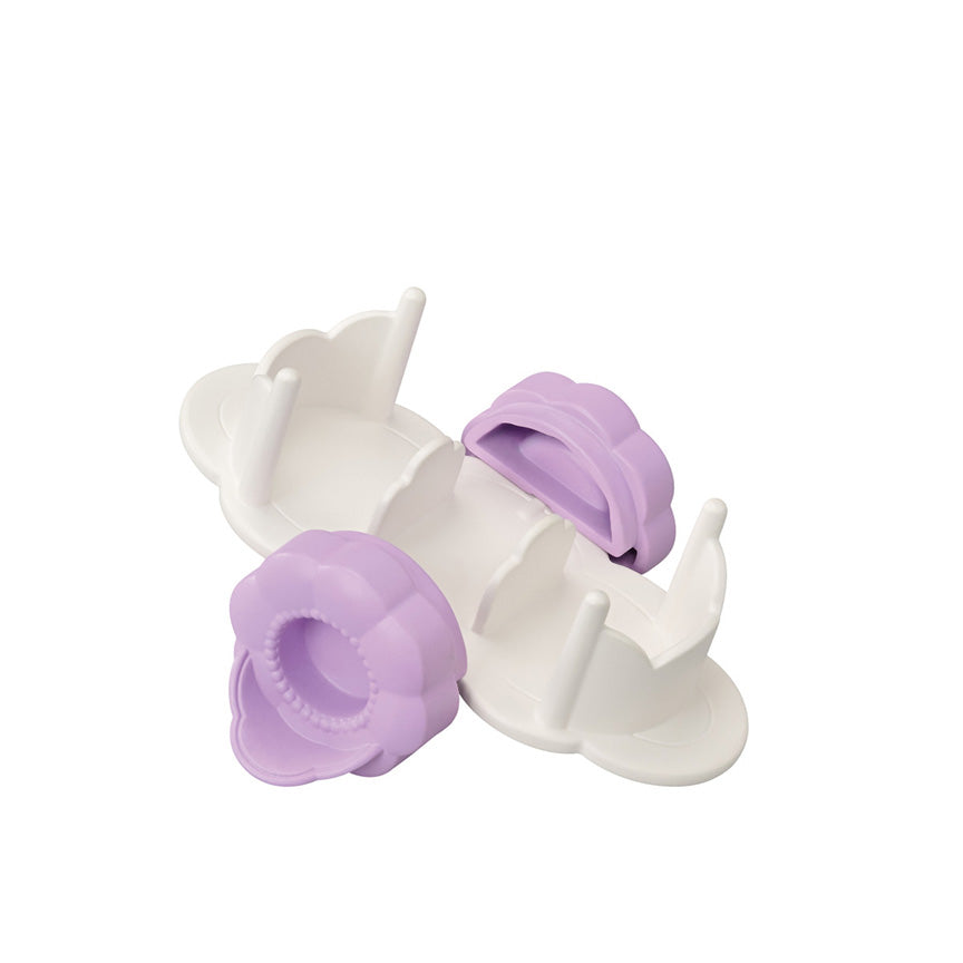 A white plastic cart with three slots, featuring two lavender purple flower-shaped wheels. This cart also converts into a table.