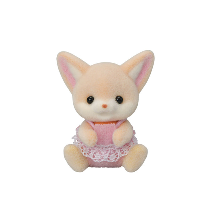 Tan and white, flocked baby fennec fox figurine sitting. Wearing a pink outfit with white frills on it. 