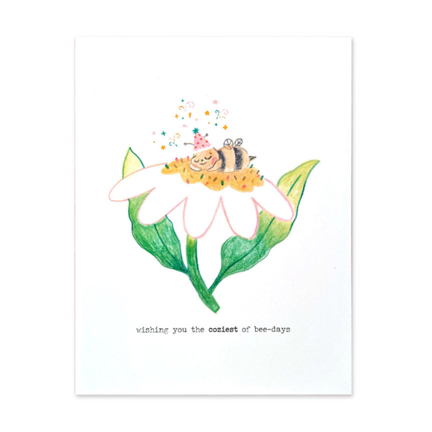 Birthday card with Illustration of a bee on a flower and the text 'wishing you the coolest of bee-days' on a white background.