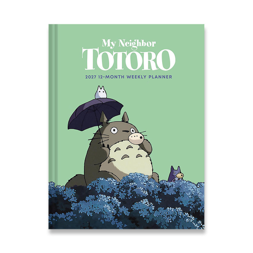 My Neighbor Totoro 2027 12-Month Weekly Planner notebook with a light green cover, featuring Totoro holding an umbrella and other characters from the film.