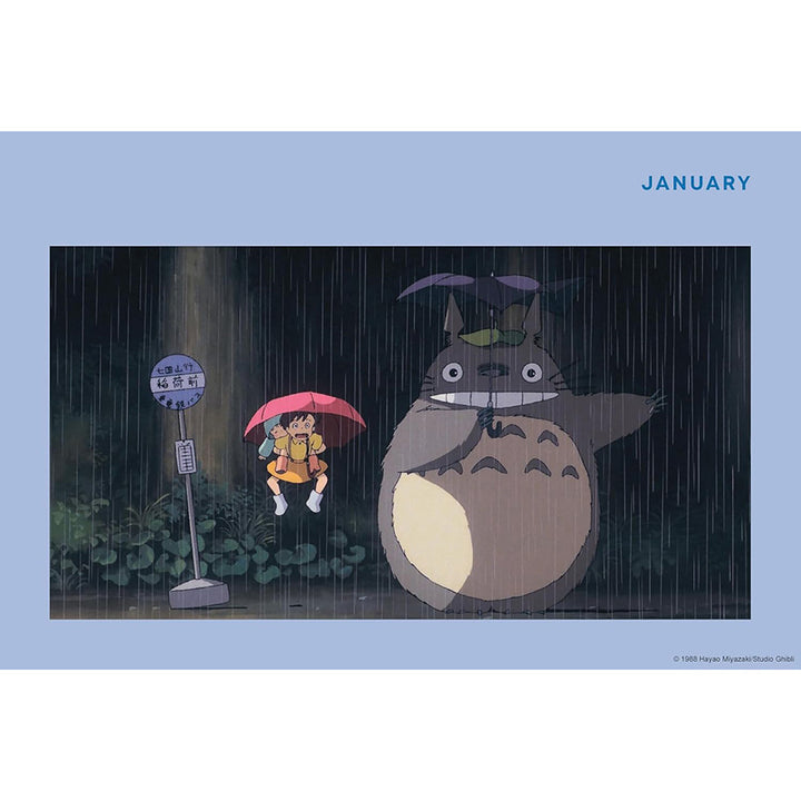 A blue page spread featuring the rainy bus stop scene from the Totoro film, with the word &