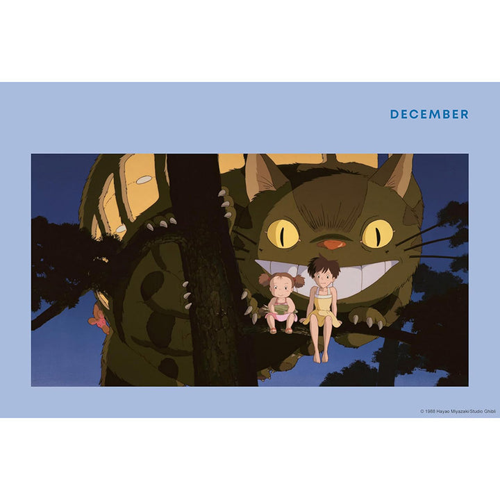 A blue page spread featuring the Cat-bus scene from the Totoro film, with the word &