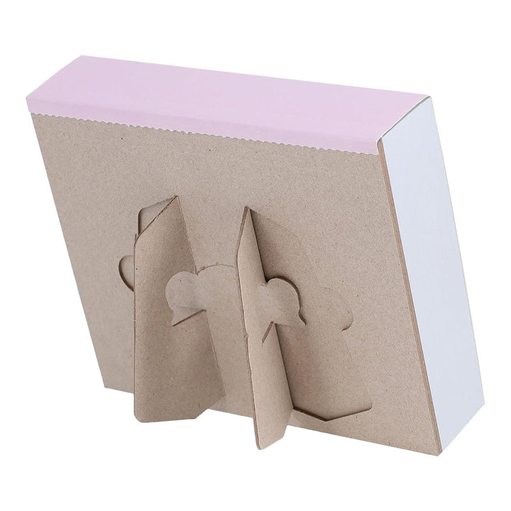 The cardboard backing of the calendar which shows that the cardboard pops out to create a stand.