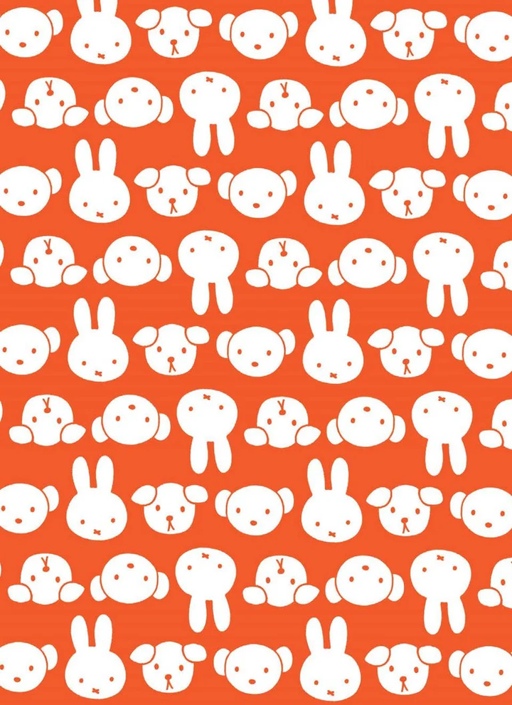 Pattern of white dog, bunny, and bear faces on an orange background