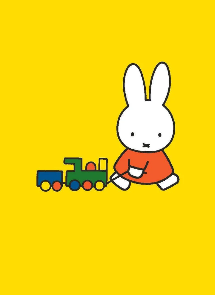 Cartoon rabbit character with a toy train on a yellow background.