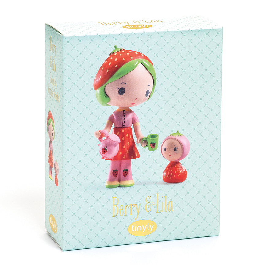 Toy packaging for Berry and Lila, featuring a photo of the dolls with text  reading "Berry &amp; Lila" with the Tinyly logo underneath against a pale teal background. 