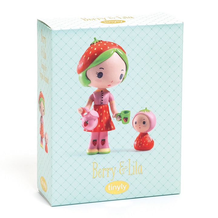 Toy packaging for Berry and Lila, featuring a photo of the dolls with text  reading "Berry &amp; Lila" with the Tinyly logo underneath against a pale teal background. 
