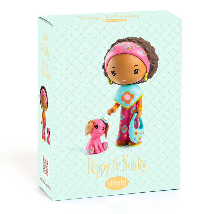 Toy packaging for Poppy and Nouky, featuring a photo of the dolls with text  reading "Poppy &amp; Nouky" with the Tinyly logo underneath against a pale teal background. 
