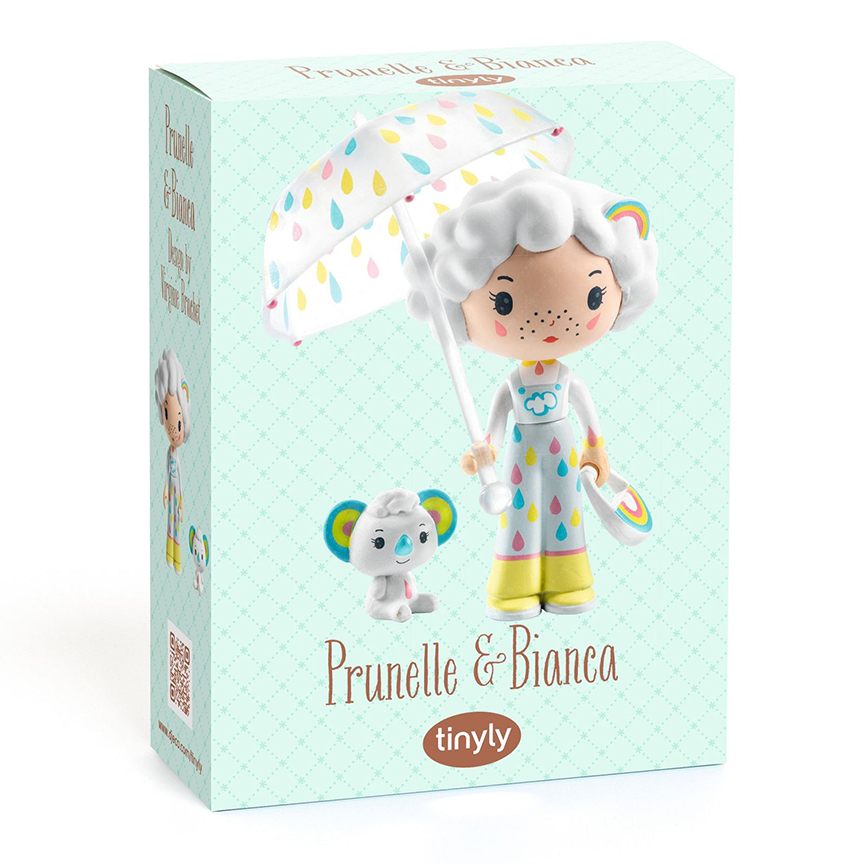 Toy packaging for Prunella and Bianca, featuring a photo of the dolls with text  reading "Prunelle & Bianca" with the Tinyly logo underneath against a pale teal background. 
