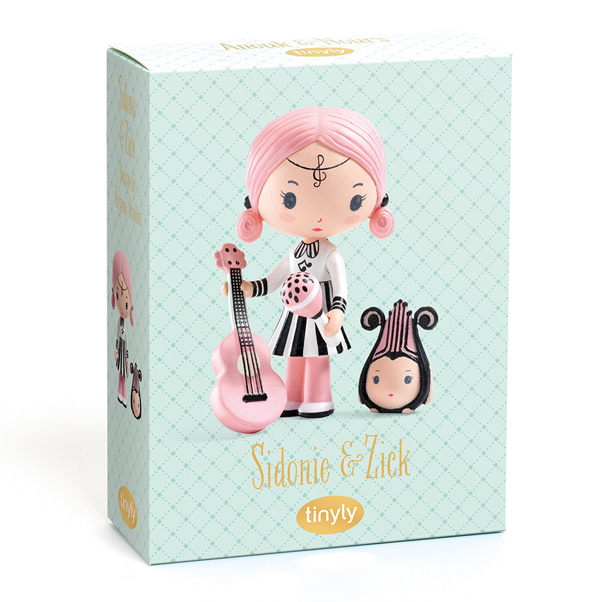 Toy packaging for Sidonie and Zick, featuring a photo of the dolls with text  reading "Sidonie & Zick" with the Tinyly logo underneath against a pale teal background. 