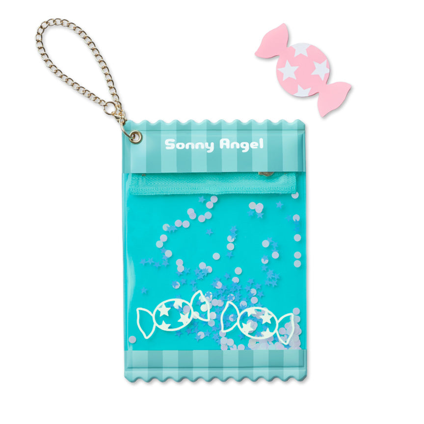 A blue candy-themed mini-figure holder pouch with a gold chain strap, featuring 'Sonny Angel' branding, candy illustrations, and blue confetti, shown on a white background with a small pink candy-shaped card. 