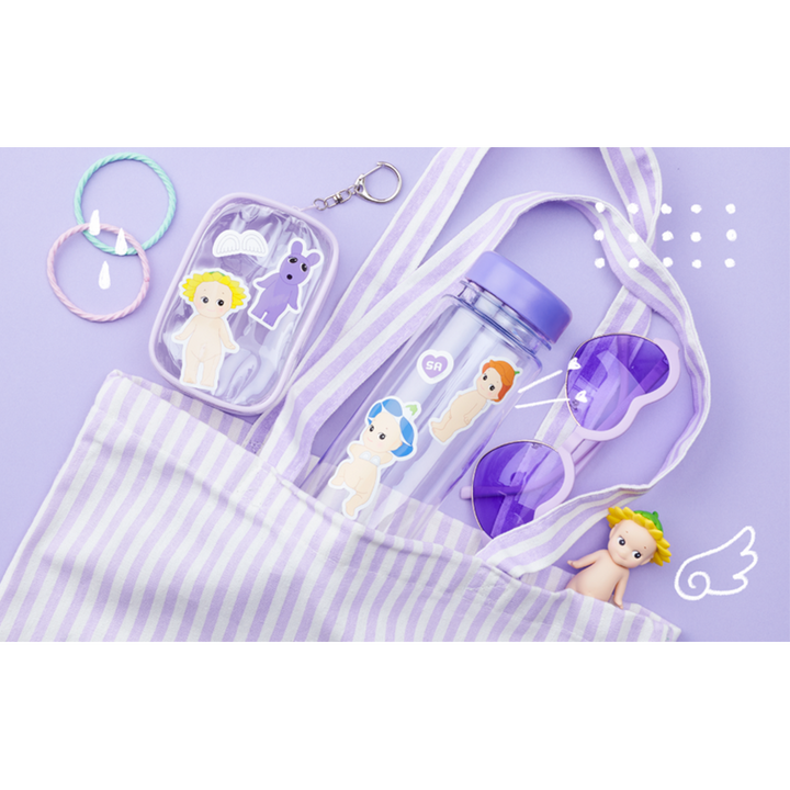A pastel purple and white striped tote bag filled with matching accessories, including a clear water bottle with character stickers, a small clear pouch, heart-shaped sunglasses, and hair ties, arranged on a light purple background.