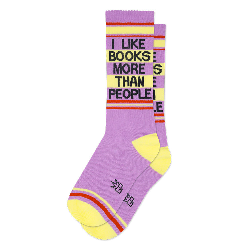 Pale yellow, lilac, and red retro gym-style crew socks with the text &