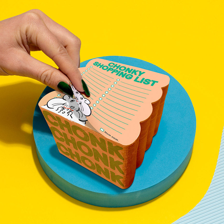 Hand interacting with orange shopping list with a hamster on it labeled "Chonky Shopping List" on a yellow background.
