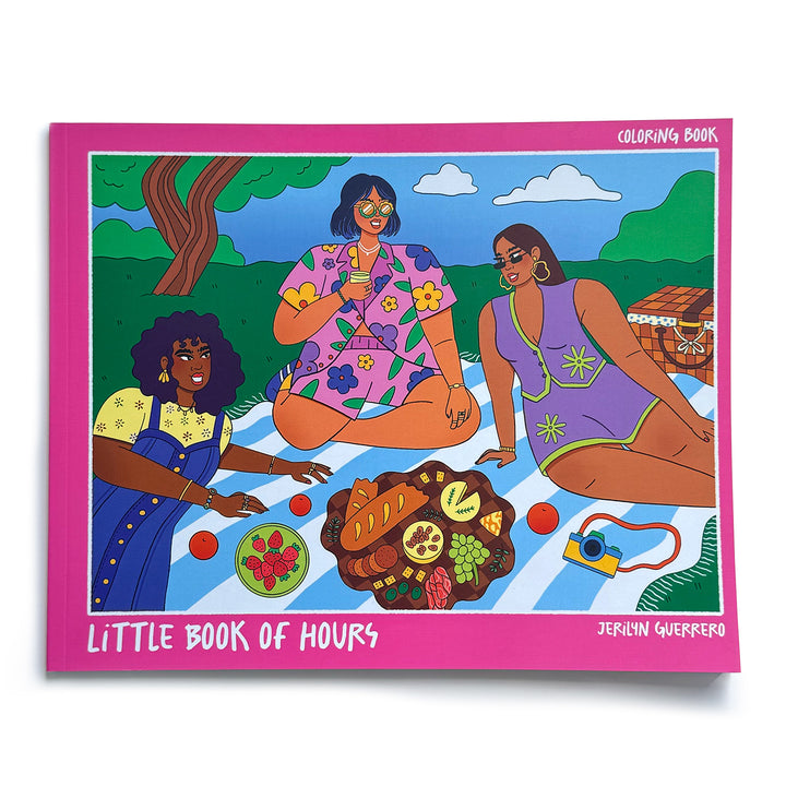 Coloring book with a hot pink border featuring a colored-in image of three girls of different skin tones (shades of black and brown) sitting at a picnic in the park. Book is titled "Little Book of Hours". 