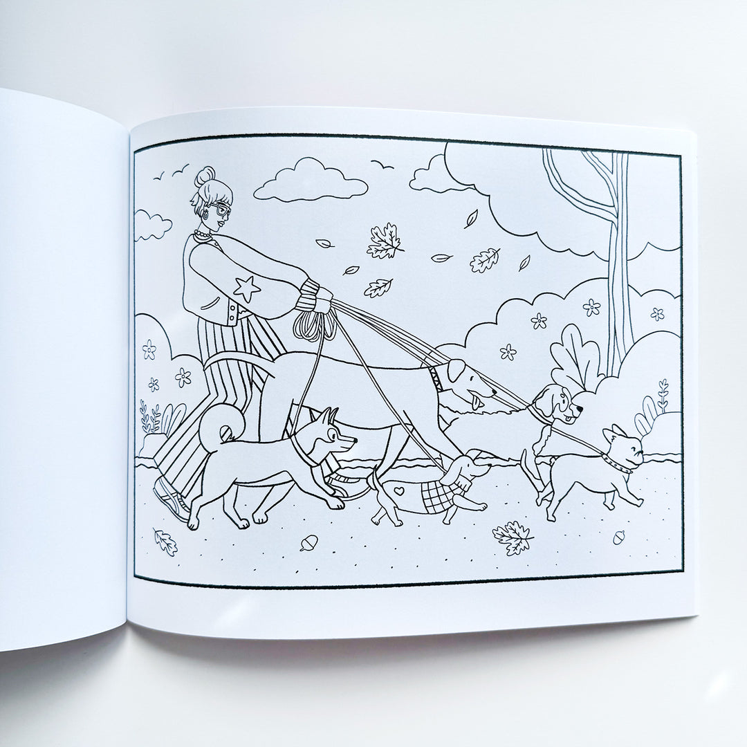 Black  and white line drawing coloring page featuring an image of a girl with an updo and trendy clothing, walking five different dogs of varying sizes in a park. Park is fall-themed with leaves and acorns. 