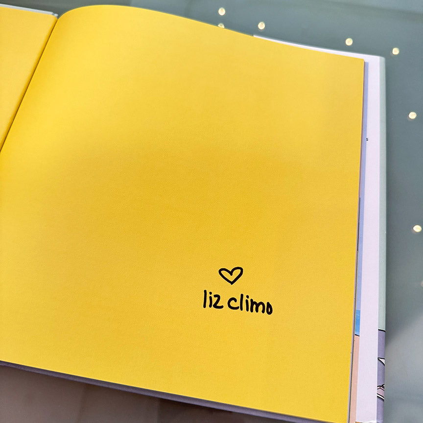 A yellow page with a signature from the author Liz Climo.
