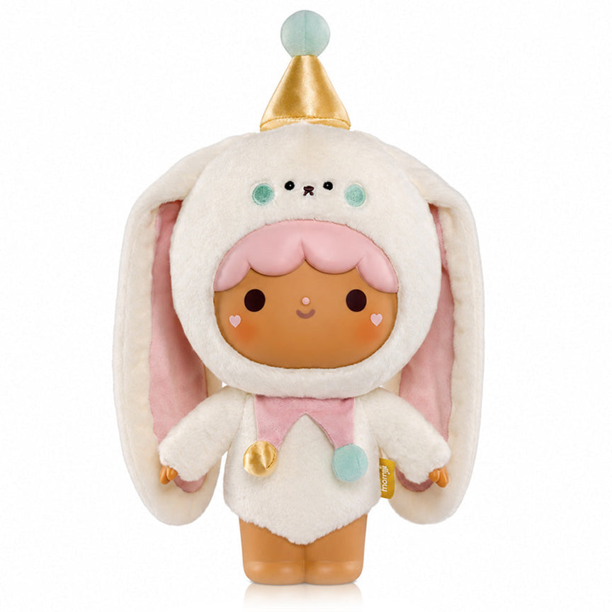 A cute plush doll with brown/tan skin and pink hair wearing a fluffy bunny costume with long floppy ears, a gold party hat, and pastel pink and blue accents. On a white background.
