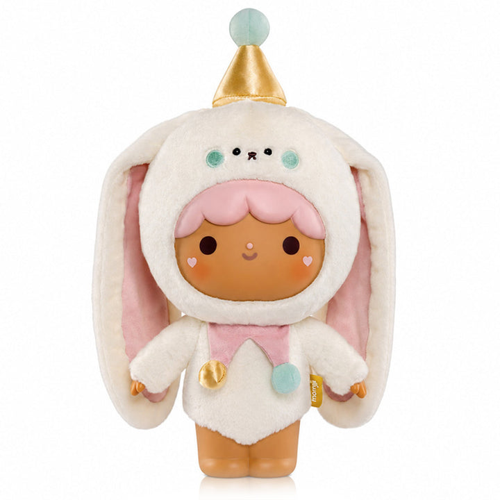 A cute plush doll with brown/tan skin and pink hair wearing a fluffy bunny costume with long floppy ears, a gold party hat, and pastel pink and blue accents. On a white background.