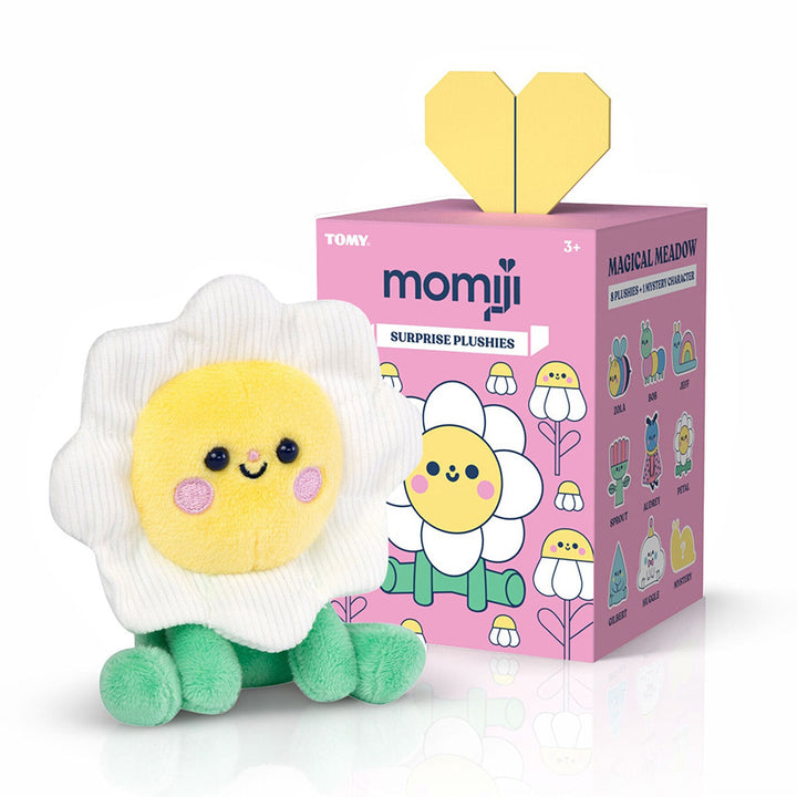 Plush of a cute smiling daisy character, sitting. White petals on daisy are corduroy material. Plush is next to it&