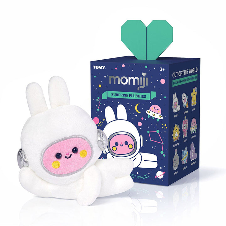 Plush of a pink bunny character laying on it&