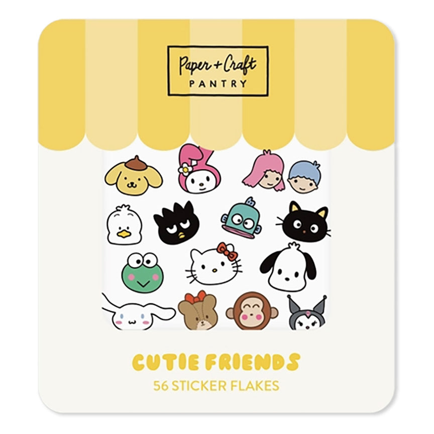A package of Paper + Craft Pantry 'Cutie Friends' sticker flakes. The packaging features a yellow and white striped awning design at the top, displaying various cute cartoon character sticker designs including Pompompurin, My Melody, Angel, Sanrio, Hello Kitty, Kuromi, Totoro, Cinnamoroll, and Monster.