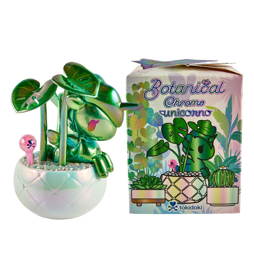 A metallic green plant-themed Unicorno figurine in a white iridescent pot, shown next to its illustrated product box labeled &