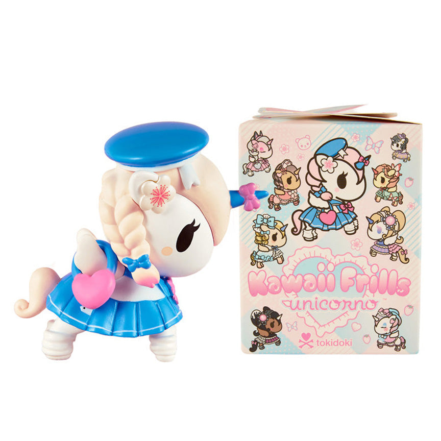 A collectible unicorno figurine in a sailor-style outfit with a blue hat and skirt, shown next to its illustrated product box labeled 'Kawaii Frills Unicorno' and the brand 'Tokidoki'.