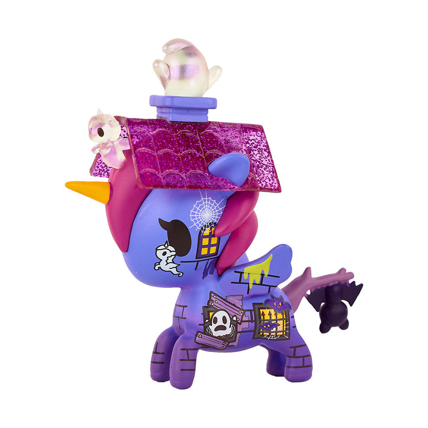 The opposite side of the Spooks Unicorno. Featuring a design with more ghosts, windows with bats coming out, and spider webs. 
