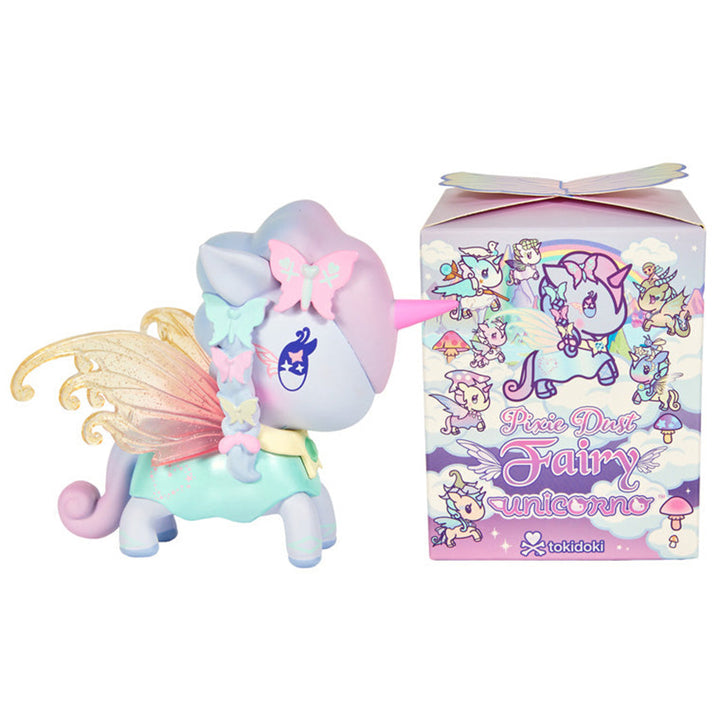 A pastel-colored winged unicorn figurine stands beside its illustrated "Pixie Dust Fairy" retail box on a plain white background. The unicorn has a lavender body, pink horn and fairy wings, and mint dress