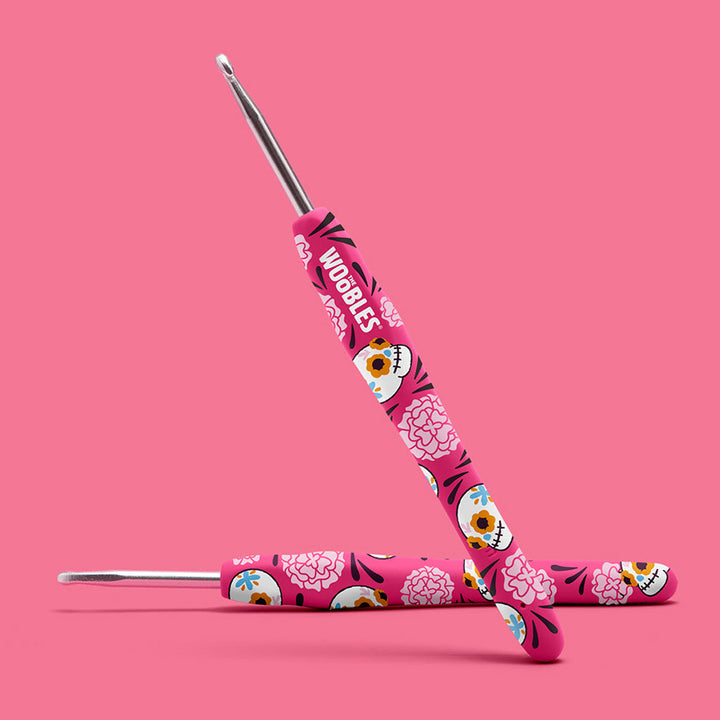Pink sugar skull and flower design crochet hook. 