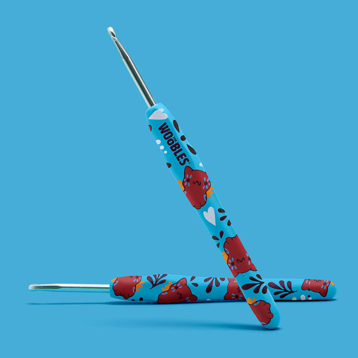 Alebrije cat and heart design blue crochet hook.