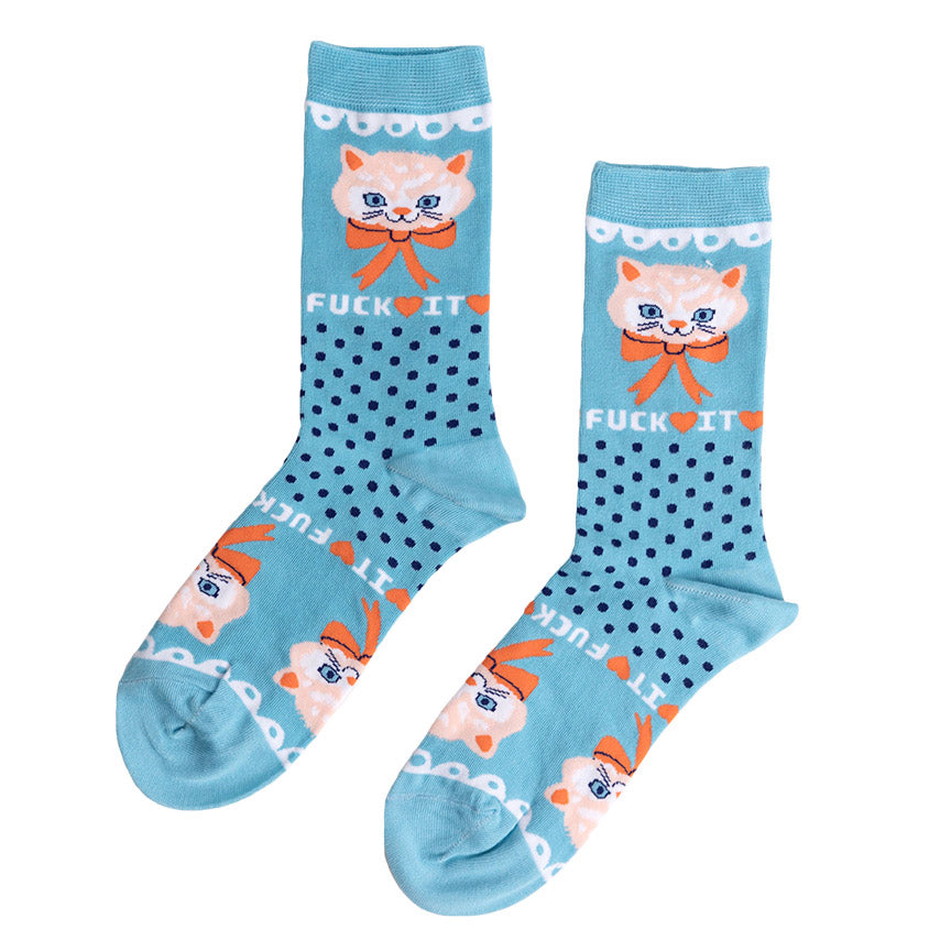 A pair of blue crew socks with orange accents, dark blue dots, and cat designs, including the text "FUCK IT."