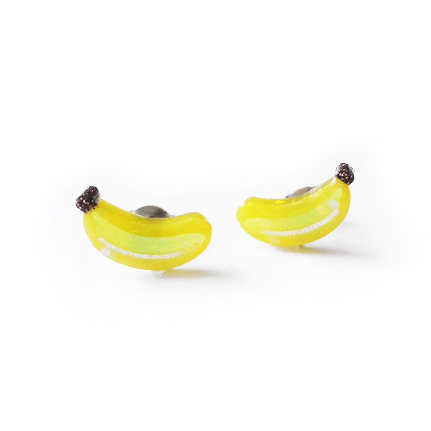 A pair of glittery banana-shaped stud earrings.