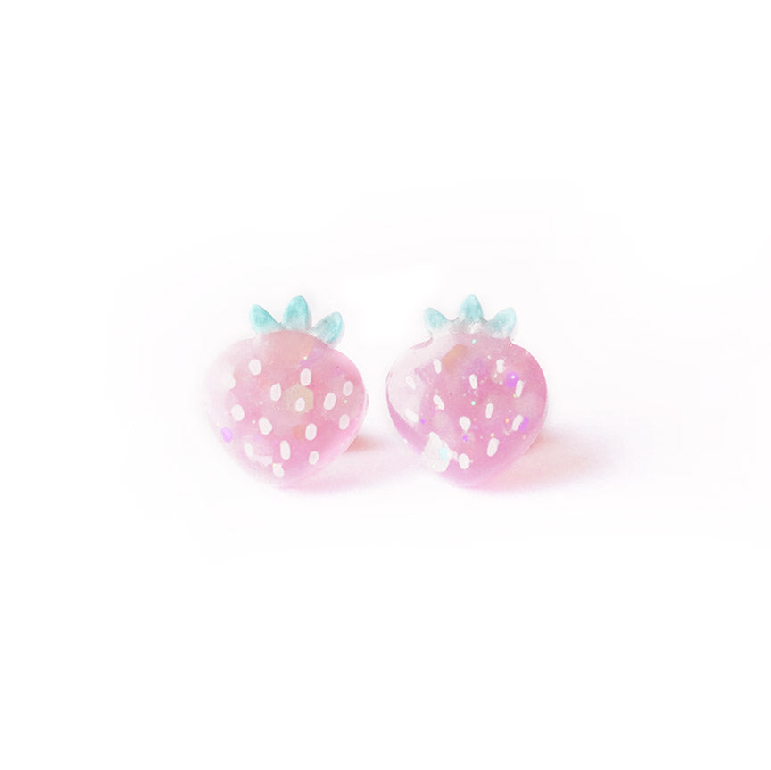 A pair of glittery pink strawberry-shaped stud earrings.